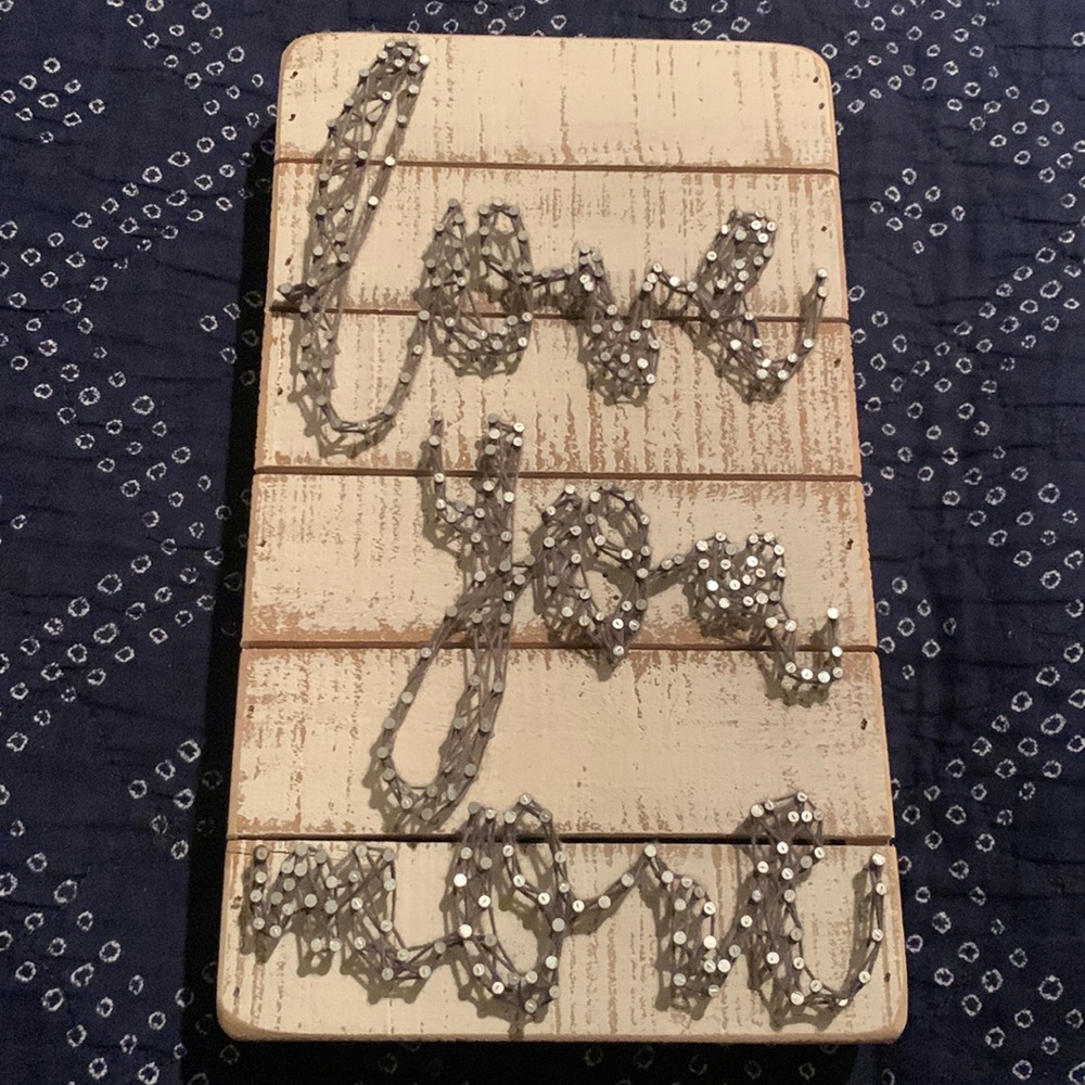 Wooden sign, nailed with string